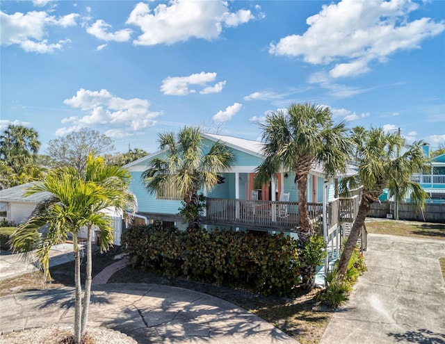 view of front of property with concrete driveway and covered porch