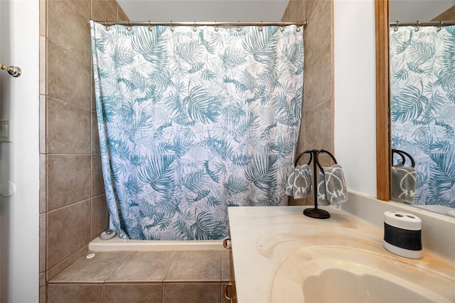 full bathroom featuring tile patterned floors, curtained shower, and vanity