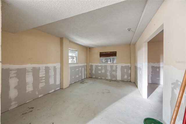 below grade area featuring a textured ceiling