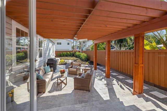 view of patio featuring an outdoor living space and fence private yard
