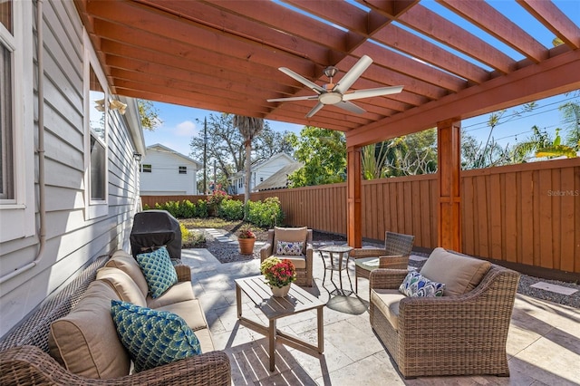 view of patio / terrace featuring a fenced backyard, a ceiling fan, a pergola, and an outdoor hangout area