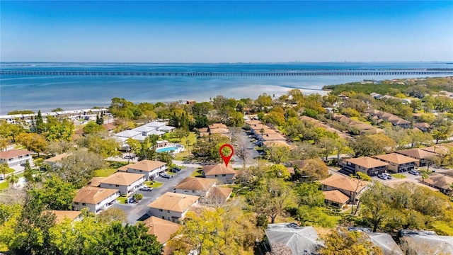 drone / aerial view with a residential view and a water view