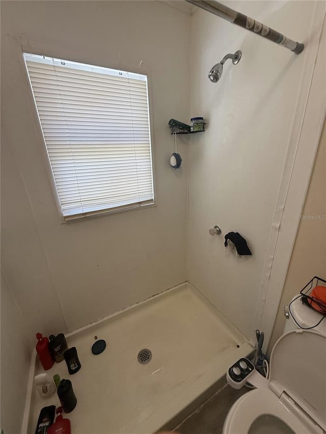 full bath featuring a shower and toilet