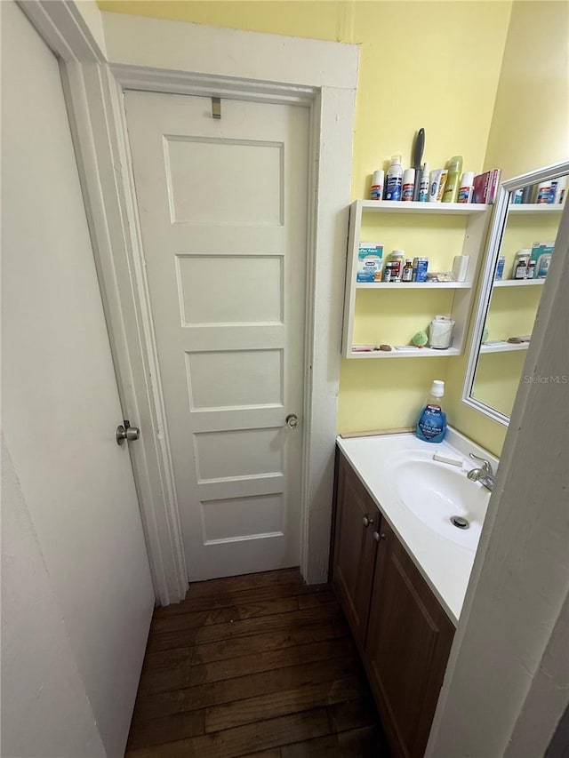 bathroom with vanity and wood finished floors