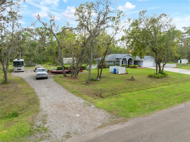 view of road featuring gravel driveway