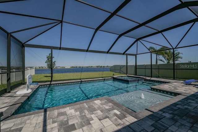 view of swimming pool with a patio area, glass enclosure, and a pool with connected hot tub