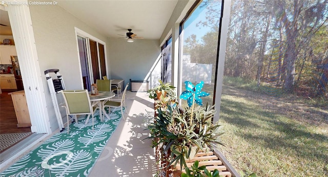 sunroom / solarium with ceiling fan