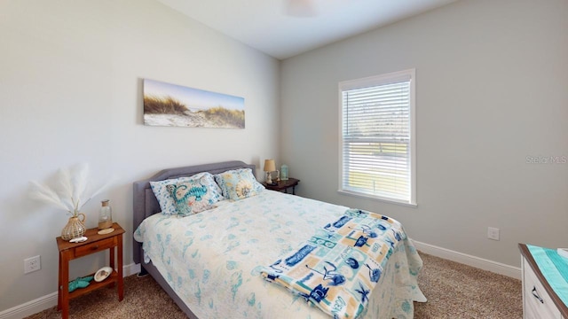 carpeted bedroom featuring baseboards