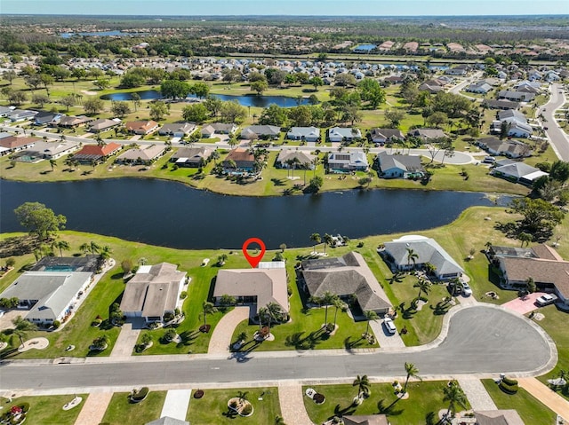 birds eye view of property featuring a residential view and a water view