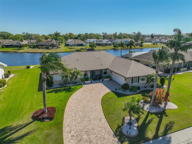 bird's eye view with a residential view and a water view