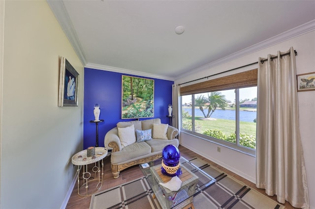 living area with baseboards, wood finished floors, a water view, and ornamental molding