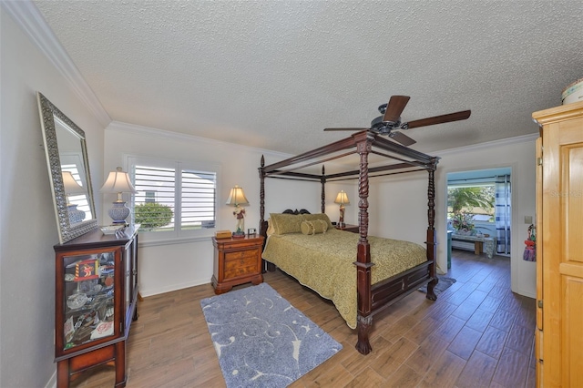 bedroom featuring multiple windows, ornamental molding, and wood finished floors