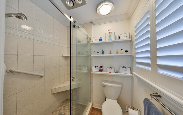 full bath with a shower stall, toilet, and ornamental molding