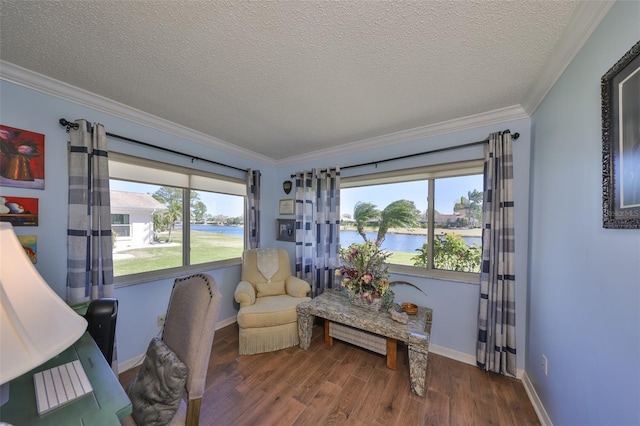 interior space with baseboards, a water view, ornamental molding, wood finished floors, and a textured ceiling