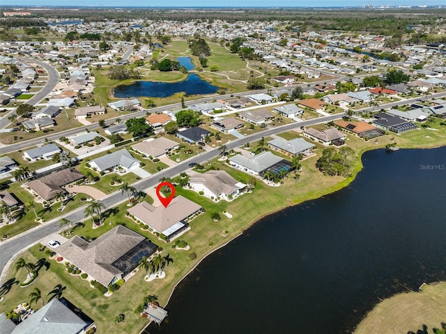 bird's eye view with a residential view and a water view