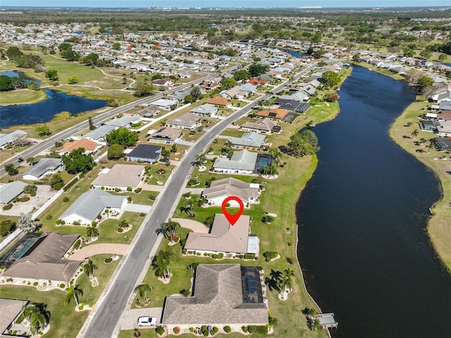 bird's eye view featuring a residential view and a water view