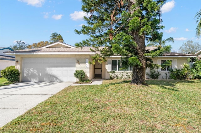 single story home with a front yard, a garage, brick siding, and driveway