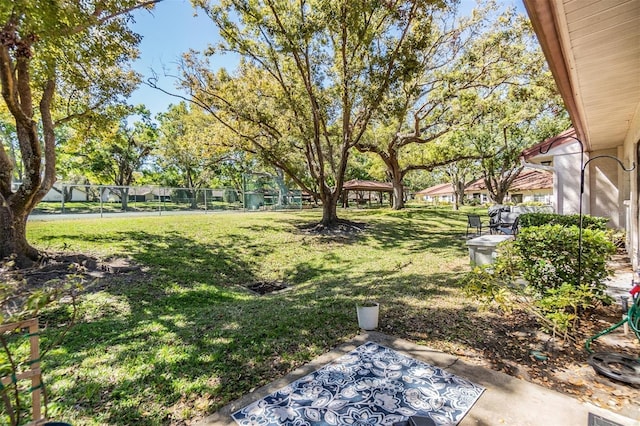 view of yard with a gazebo and fence