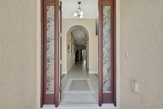 hallway featuring arched walkways