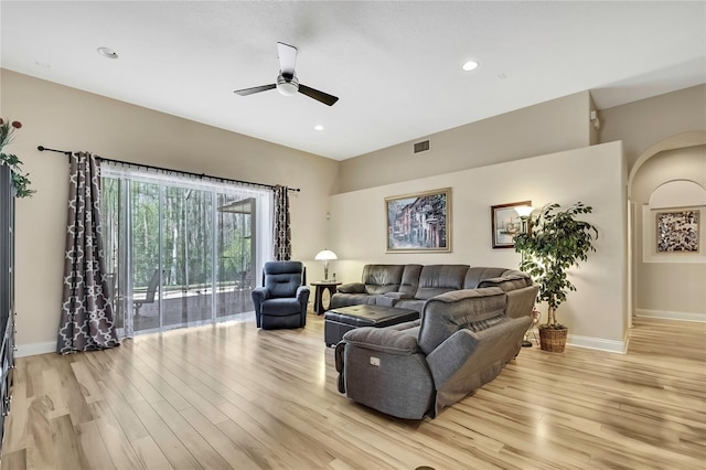 living area with light wood finished floors, visible vents, baseboards, and ceiling fan