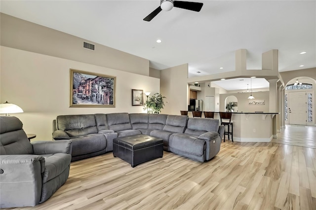 living area featuring light wood finished floors, visible vents, baseboards, recessed lighting, and a ceiling fan