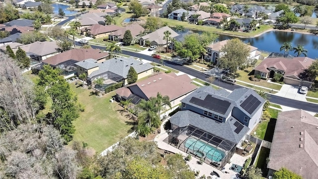 birds eye view of property featuring a residential view and a water view