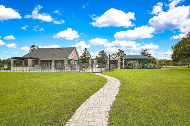 view of yard with fence and playground community