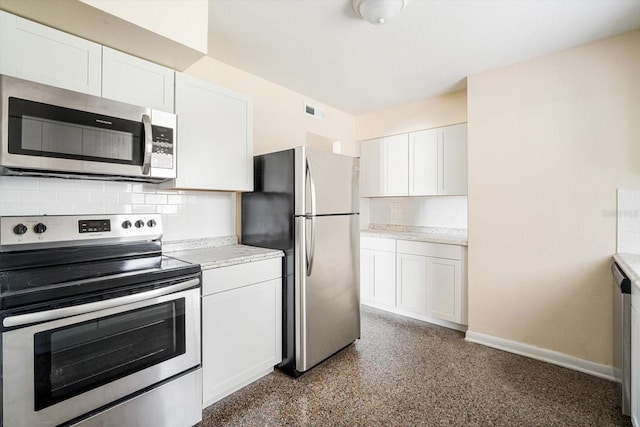 kitchen with decorative backsplash, white cabinetry, visible vents, and appliances with stainless steel finishes