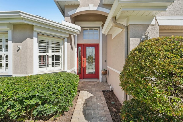 property entrance featuring stucco siding