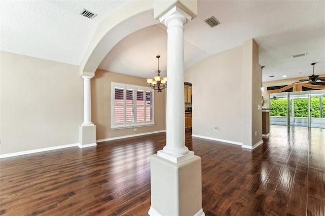 unfurnished room with visible vents, plenty of natural light, and vaulted ceiling