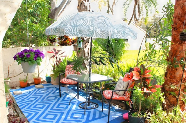 view of patio / terrace featuring fence