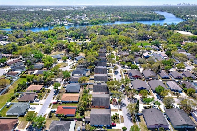 birds eye view of property with a residential view and a water view