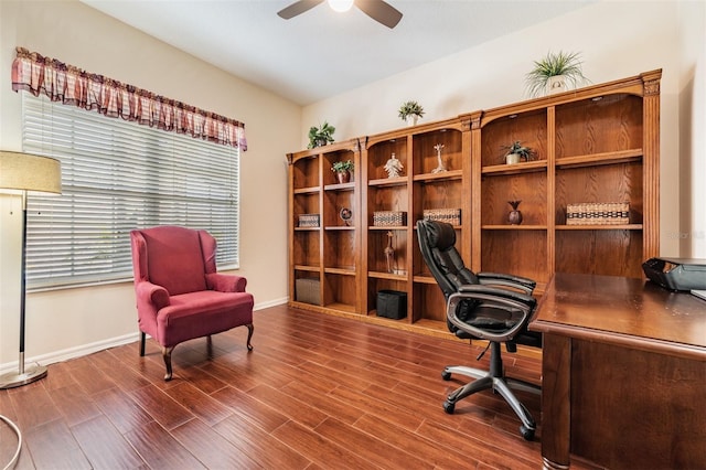 home office featuring baseboards, wood finished floors, and a ceiling fan