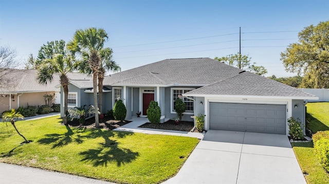 ranch-style house with concrete driveway, a front yard, roof with shingles, stucco siding, and a garage