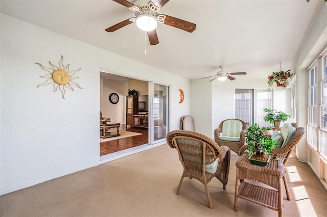 sunroom / solarium with ceiling fan