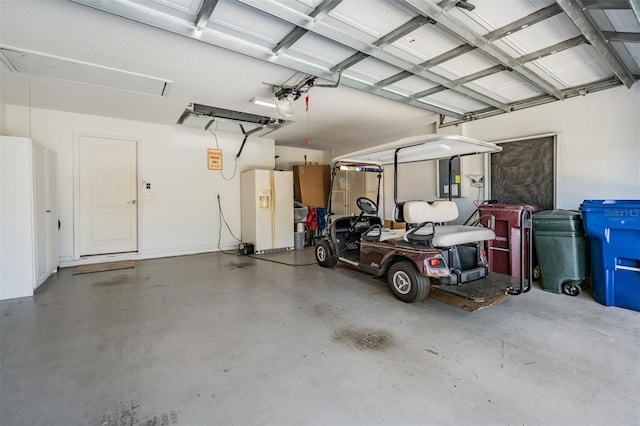 garage featuring white fridge with ice dispenser