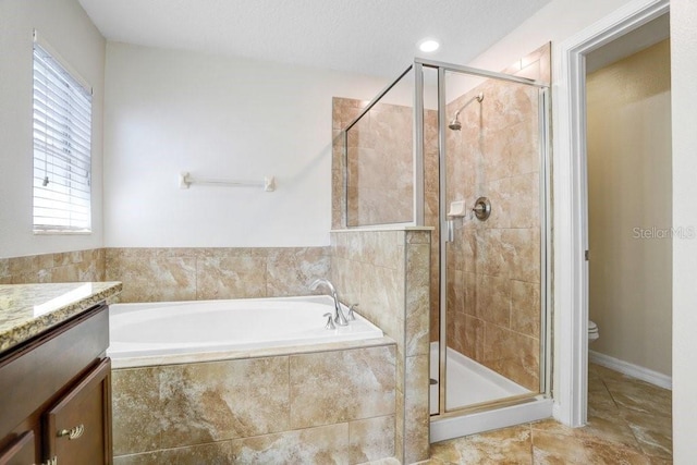 bathroom with tile patterned floors, toilet, a stall shower, a bath, and vanity