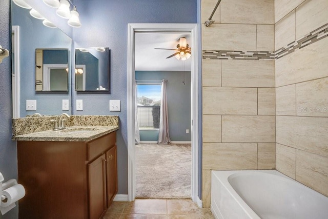 full bath featuring tile patterned floors, shower / bathing tub combination, baseboards, ceiling fan, and vanity