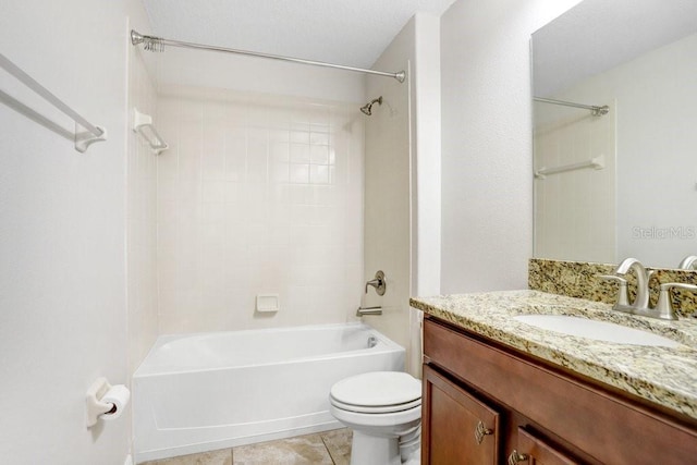 bathroom with tile patterned floors, toilet, shower / washtub combination, and vanity