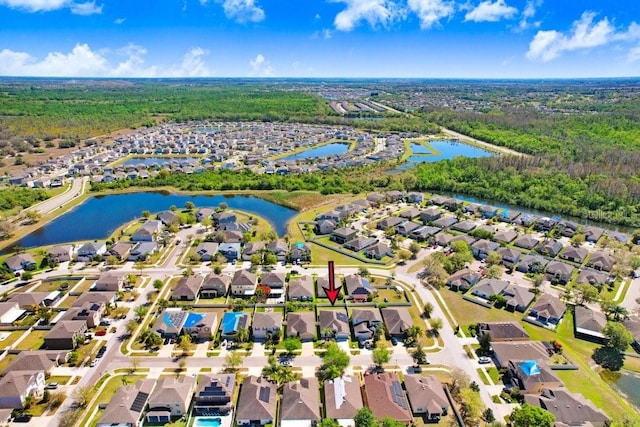 birds eye view of property featuring a residential view and a water view