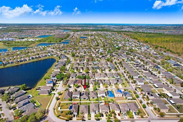 aerial view with a residential view and a water view