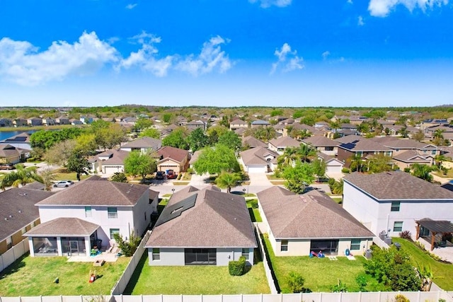 birds eye view of property with a residential view