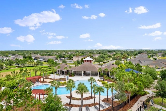 pool with a gazebo, fence, a patio area, and a residential view