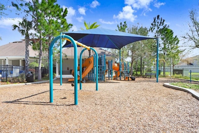 community jungle gym featuring fence