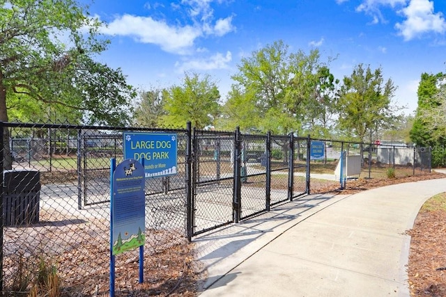 surrounding community featuring fence and a gate