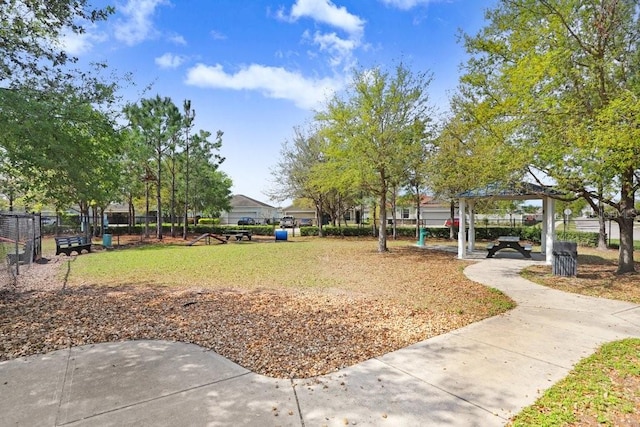 view of property's community with a gazebo and fence