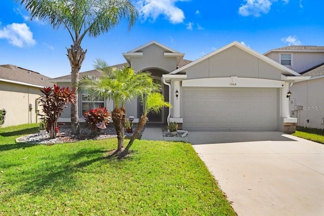 view of front of property featuring stucco siding, a front lawn, concrete driveway, and an attached garage