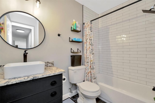 full bath featuring vanity, shower / bath combination with curtain, and toilet