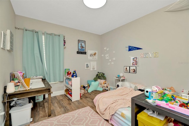 bedroom featuring wood finished floors