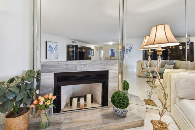 living room with a fireplace and visible vents